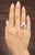 This stunning vintage-inspired cocktail ring showcases a 1.56-carat oval-shaped tanzanite in a vivid, rich blue hue. The...