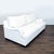 This Pottery Barn 3-seat sofa features a clean white upholstery, plush back and seat cushions, and gently curved arms for...