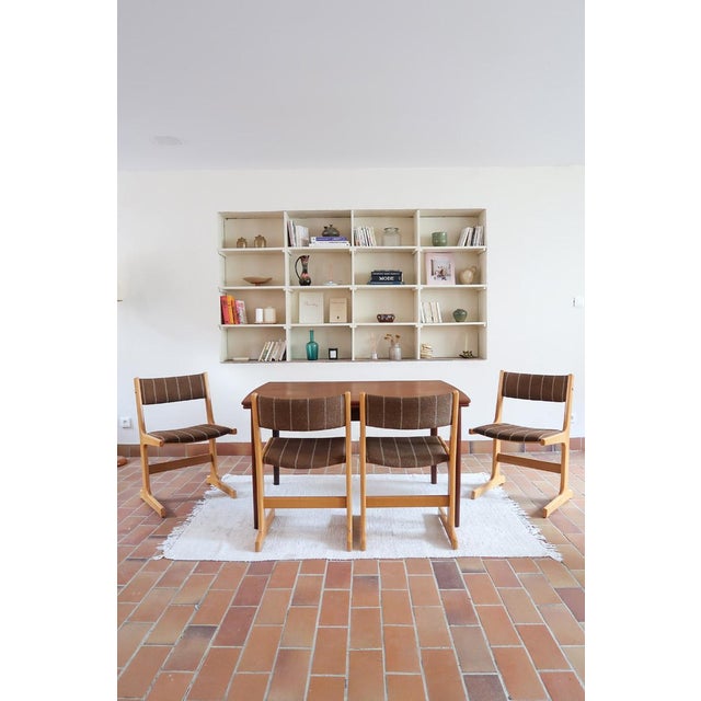 A set of four danish dining chairs made by farstrup in the 1970s, labelled made in denmark by farstrup under the seat, so...