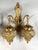 A beautiful vintage Louis XVI-style wall lamp / sconce, crafted circa 1980 from gilded bronze and finished with two...