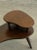 W29.5 D19 H21.5 Vintage oak two-tier side table featuring a sculptural Mid-Century Modern design. This unique piece has...
