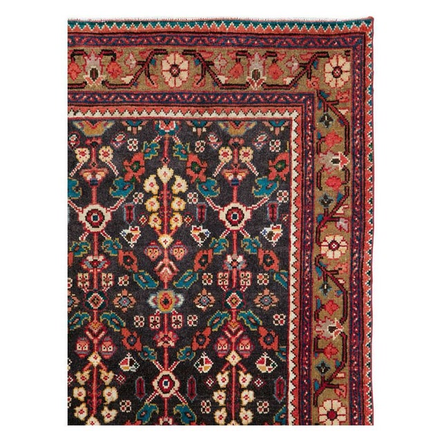 A vintage Persian Hamadan carpet in long and narrow gallery format handmade during the mid-20th century. Measures: 4' 4" x...
