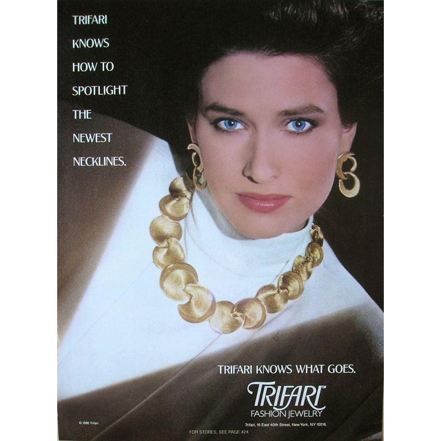 1986 Modernist sculptural textured goldtone swirl with brown swirl enamel edging brooch with security clasp. Marked...