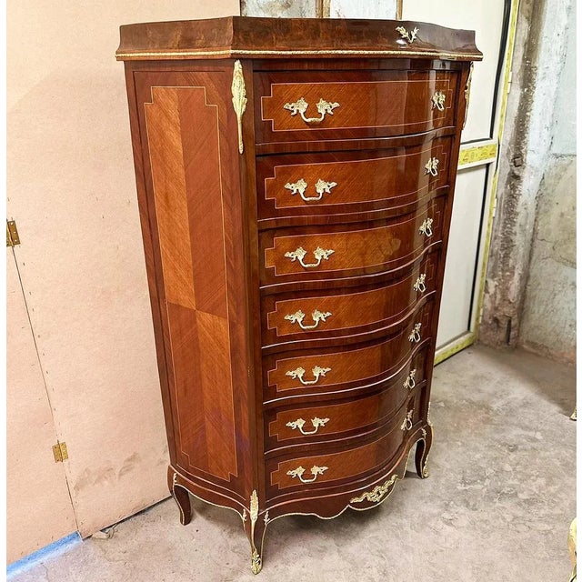 Stunning commode. Tall, narrow and shallow chest of drawers, characterized by having eight drawers. Boullé style...
