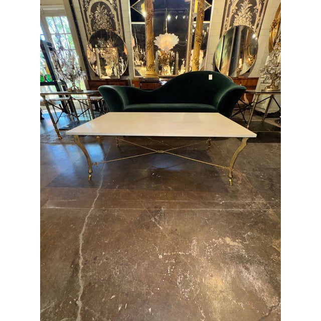 The Vintage Italian Gilded Iron and Travertine Coffee Table is a stylish and elegant piece of furniture perfect for any...
