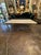 The Vintage Italian Gilded Iron and Travertine Coffee Table is a stylish and elegant piece of furniture perfect for any...