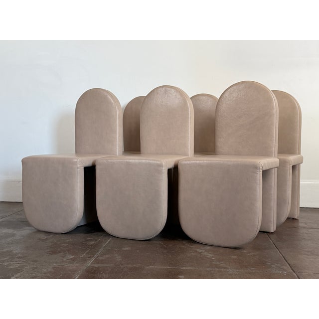 Set of six leather chairs in great condition by Cuff Studio. Almond color leather. Great condition, minor scuffs. Signed....