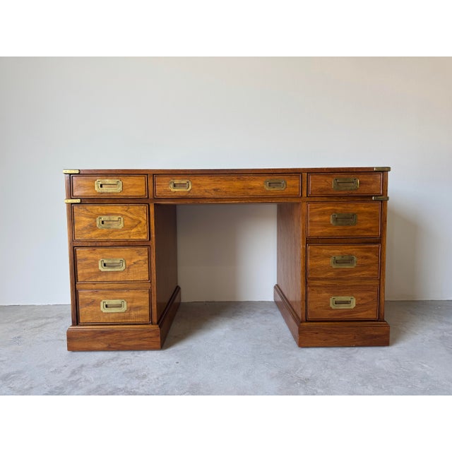A refined 1970’s Hollywood Regency executive desk by National Mt. Airy, known for its exceptional craftsmanship and high-...