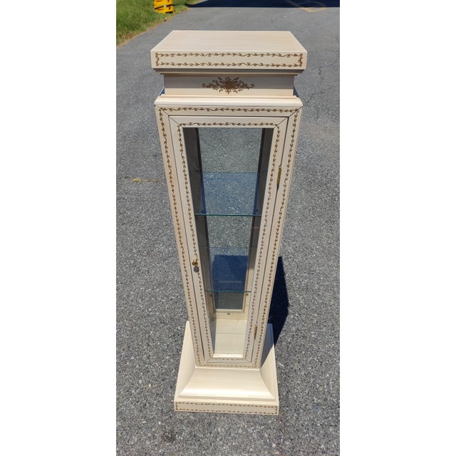 pedestal / display case in Empire style . Decorative Curio/display case fitted with 3 faceted windows + 1 door in glass ,...