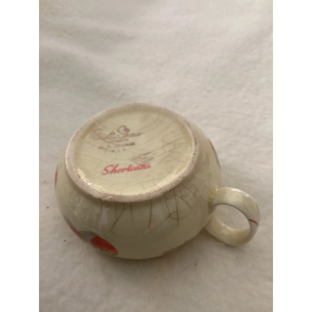 This beautiful antique strawberry shortcake creamer dates back to the 1940s. It is known for its wide mouth and short...