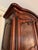 An exceptional 18th-century French Louis XV country walnut armoire, circa 1770, distinguished by richly figured burr elm...