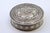 Circular Silver Box with Floral Reliefs and Hinged Lid, in Very Good conditions. Designed before 1890 This piece has an...