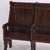 Each bench comprised of two joined seats with straight back, curved handholds, pieced side details, supported by arched...