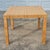 This is a wonderful vintage rattan wrapped square dining table. The table is unsigned but the style resembles Bielecky...