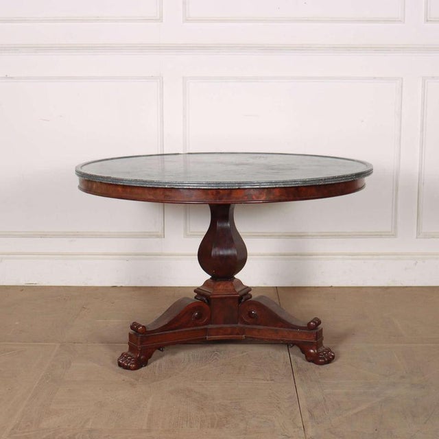 Large 19th century French marble topped gueridon with a good carved walnut base. 1820. The marble is 1-inch thick. This...