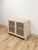 This lovely vintage cream rattan lattice cabinet is a warm and beautifully detailed coastal and Hollywood Regency...