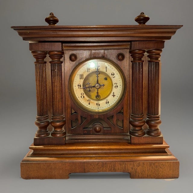 This listing is for an antique German mantel clock. The clock has a nice geometric case with carved detailing. The clock...