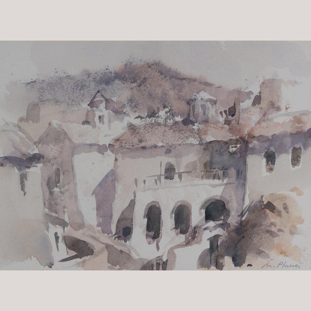 This watercolor painting by Manel Plana depicts a sunlit architectural view of a Mediterranean village. The composition...