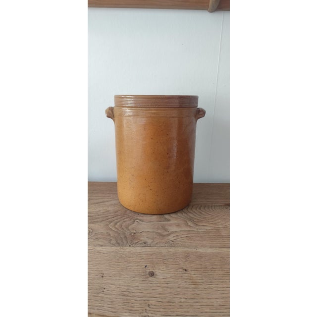 Large antique French stoneware confit or preserving pot dating from the early 20th century. Crafted in traditional glazed...