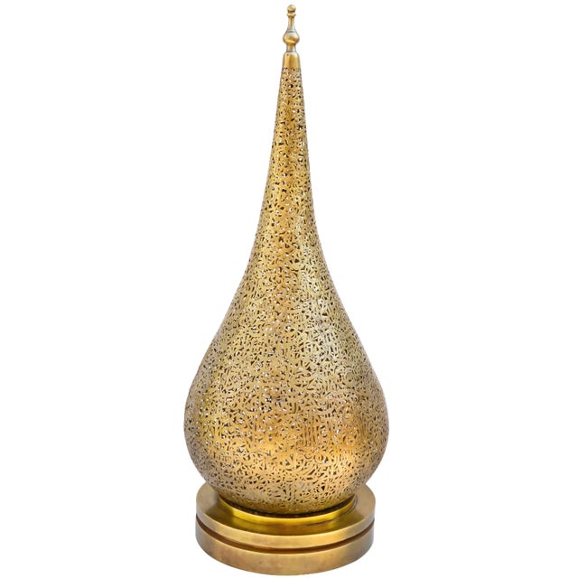 Hand-crafted Moroccan brass table lamp featuring an ornate hand-engraved and reticulated Moorish pattern and calligraphy...