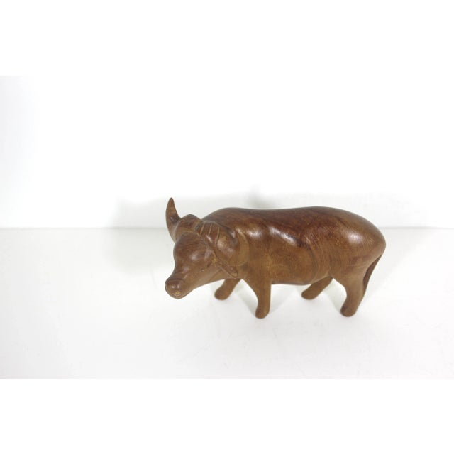 Classic mid century modern hand carved wood water buffalo sculpture. This is in excellent condition and shows minimal wear...
