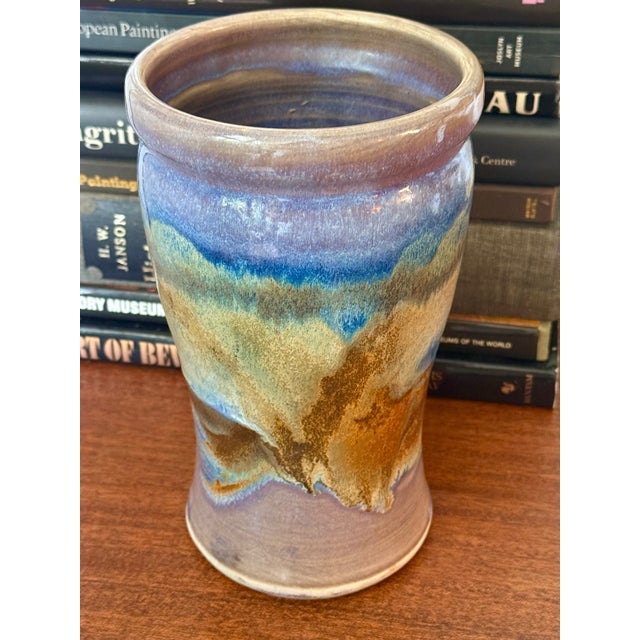 Unique Artisanal turned-pottery vase glazed in purples, blues, and browns. Use for utensil holder, flower bouquet, or...