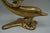 Beautiful vintage solid brass dolphin sculpture featuring two stylized dolphins in a dynamic leaping form. This sculptural...