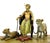 Orientalist bronze pharaoh sculpture with lionesses in polychrome finish, inspired by Persian and Egyptian revival art of...