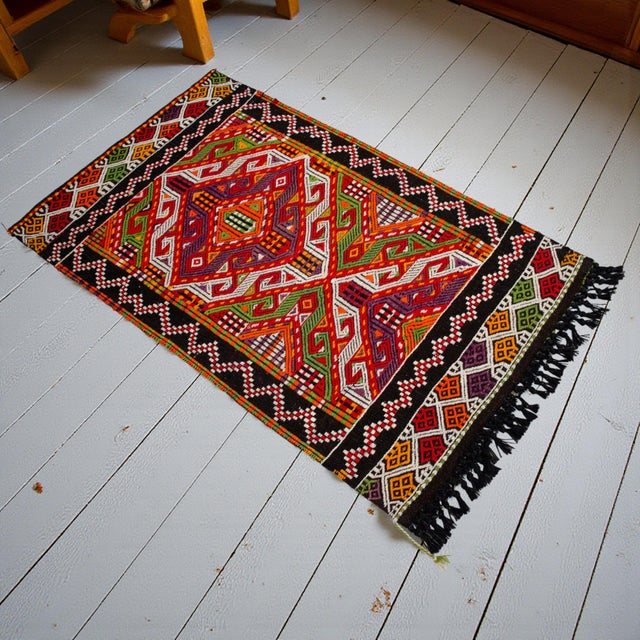 This exquisite hand-woven kilim captures the vibrant nomadic soul of Anatolia with its beautifully textured flat-weave...