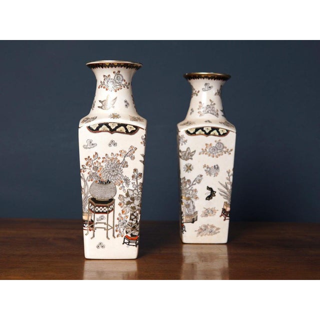 2 porcelain vases Epoch & style: 20th century : A pair of porcelain vases with an underglaze painting depicting a flower...
