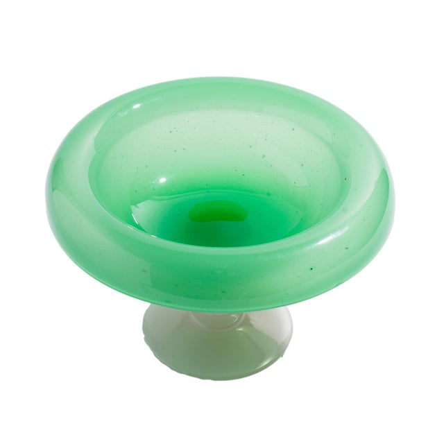 A Steuben blown glass compote made in Corning, New York, around 1920. The wide, shallow bowl is blown in Steuben's...