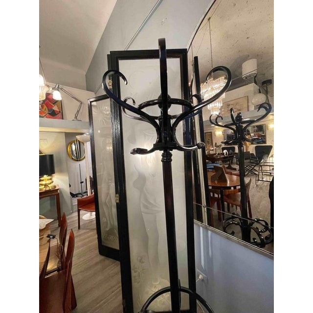 Thonet coat rack made of walnut and restored with an ebonized finish. The coat rack is made of bentwood and is ideal for...