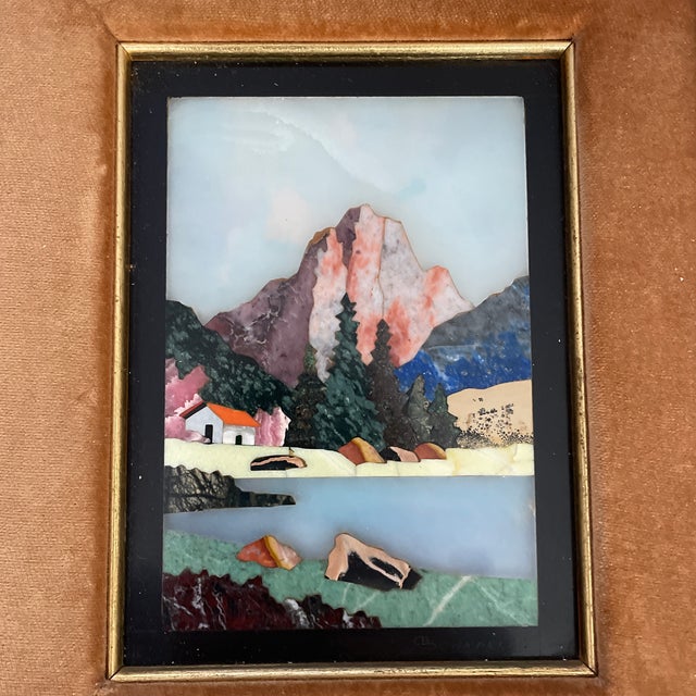 Colorful signed mosaic landscape with mountain, river and evergreen trees; beautifully framed with velvet matting....