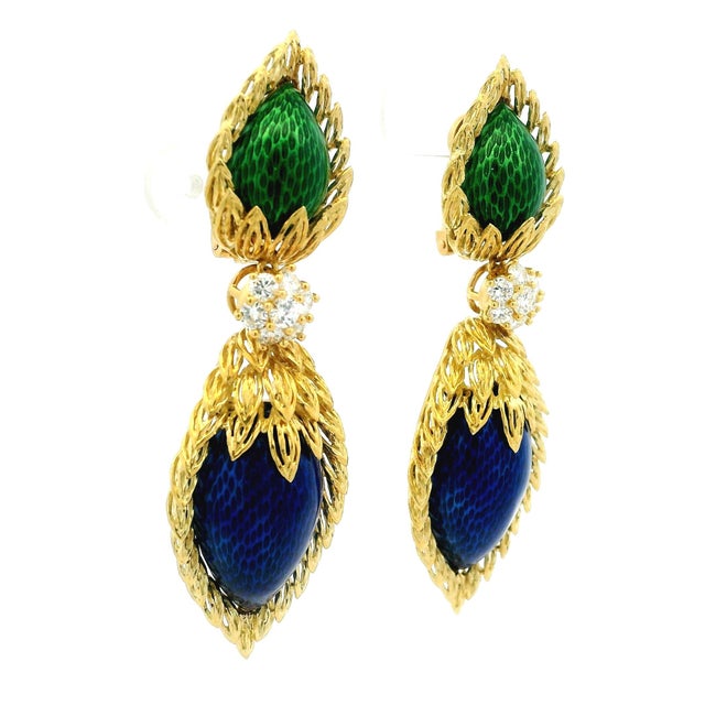 A dramatic pair of French-made pendant ear clips by Spritzer & Fuhrmann, crafted in 18K yellow gold with richly saturated...