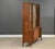 A mid century modern walnut three drawer, two door one piece credenza hutch made by Kent Coffey Perspecta. Professionally...