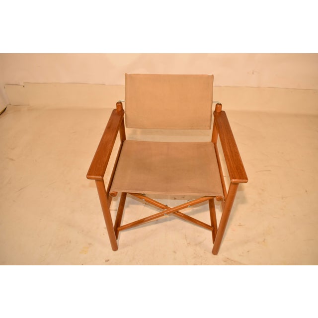 Mid-century director's chair made from maple with a canvas seat and tilting seat back. This chair is so charming! The...