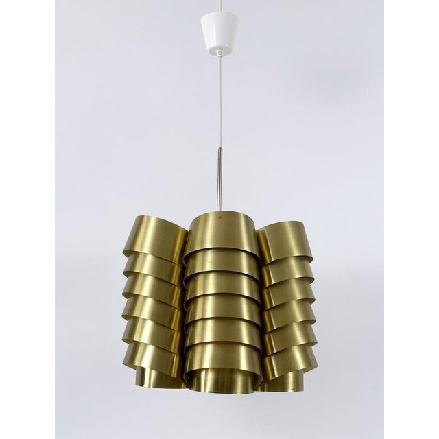 Rare, lovely and highly decorative mid-century modern brass pendant lamp or chandelier. Designed by hans-agne jakobsson...