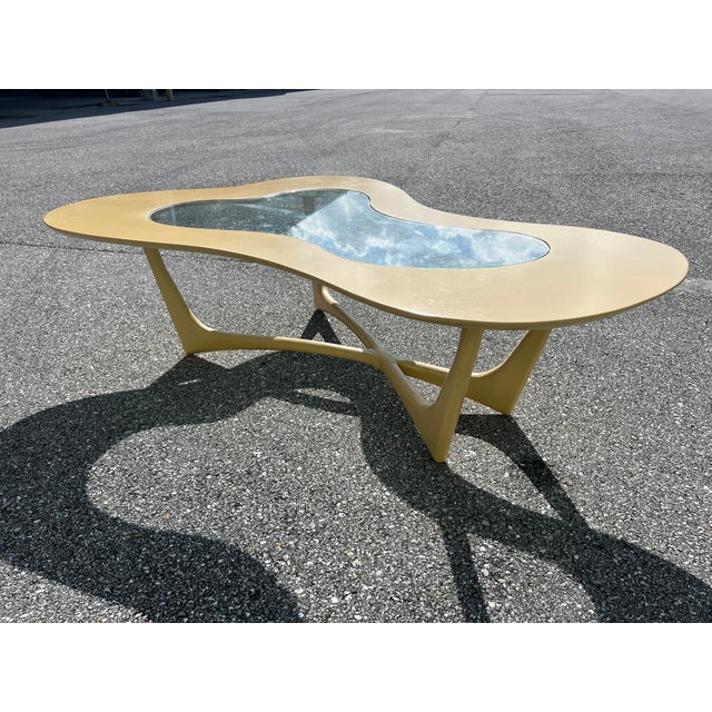 A classic biomorphic coffee table by Lane, circa 1960s. Made of walnut, glass top. Similar to: Adrian Pearsall (Designer