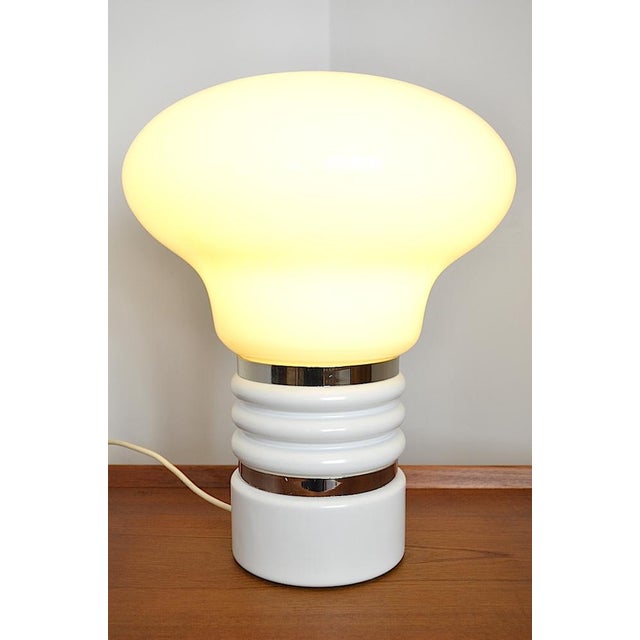 This Bulb table lamp in the shape of a light bulb was produced in the 1970s - the lower part of the lamp is made of white...
