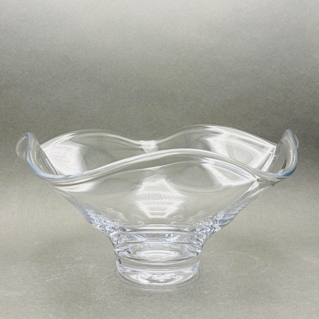 This is a stunning hand-blown clear crystal bowl featuring the signature fluid, ruffled rim of the Chelsea collection by...
