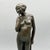 An art deco bronze sculpture of a nude woman in a pensive pose with a drape held behind her back. Signed k. Murray...