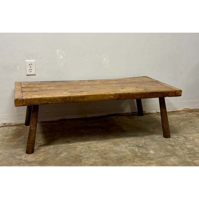 This 19th century English fruitwood coffee table is a beautiful study in evolution—an object shaped not in a single...