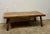 This 19th century English fruitwood coffee table is a beautiful study in evolution—an object shaped not in a single...