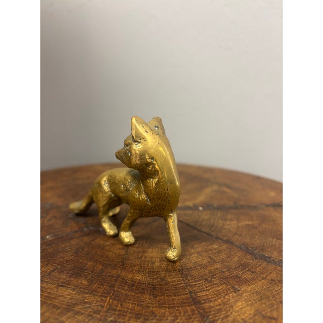A vintage English brass fox, full of charm and character, with a lovely surface showing gentle wear and a rich, mellow...