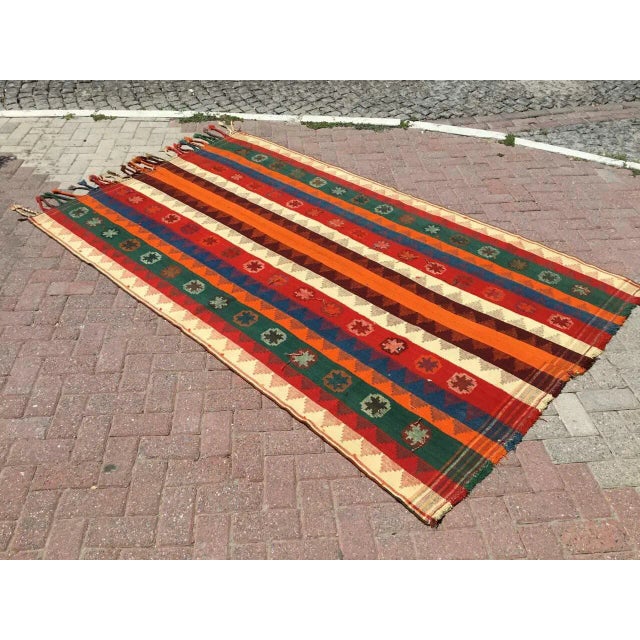 Beautiful, vintage, handwoven Kilim is approximately 60 years old. It is handmade of very fine quality, hand-spun wool in...