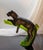 Elegant black panther resting on a green branch, stunningly rendered in pate de verre glass by French maker, Daum. Pate de...