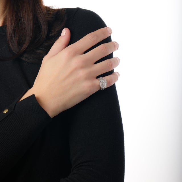 This striking vintage diamond ring is a dazzling reflection of 1980s elegance, defined by scale, brilliance, and confident...