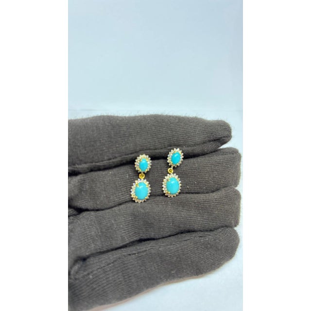 Gemstone details Diamond weight: 0.60 cts Turquoise weight: 3.05 cts 14K gold Gross weight: 3.87 grams Gold weight: 3.14...