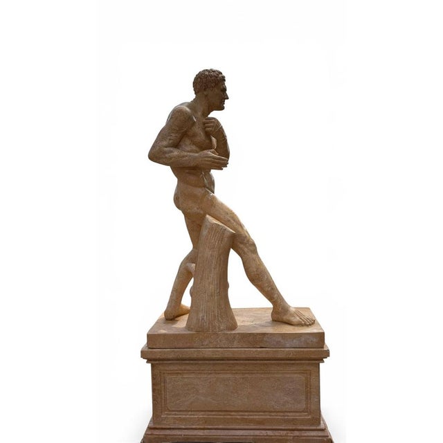 Magnificent and imposing Greek athlete sculpture, hand-carved in Italian marble during the 20th century. Inspired by the...