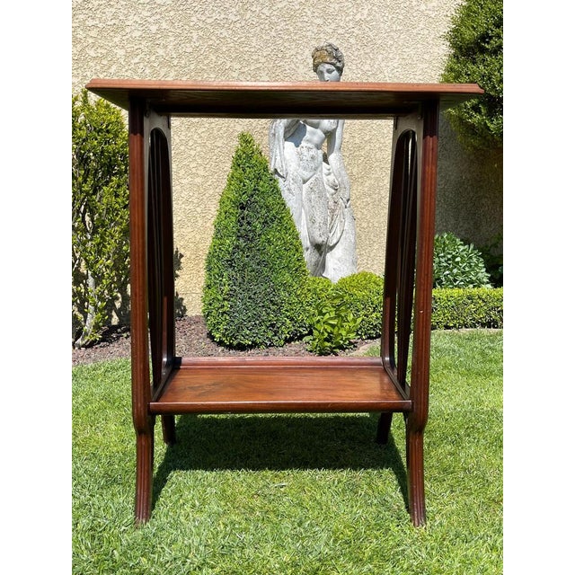 Lovely little table in solid mahogany and Art Nouveau style marquetry top signed "Louis MAJORELLE Nancy". Tray decorated...